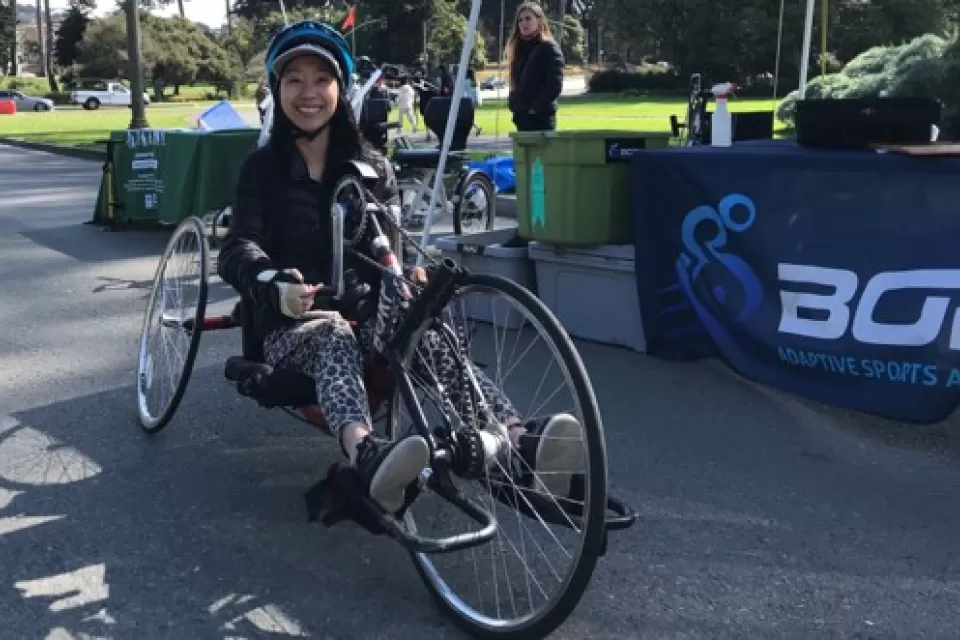 Woman sitting on recumbent bike